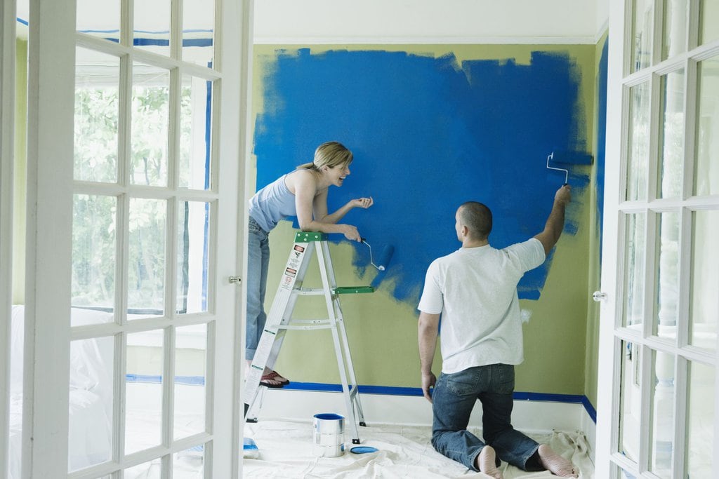 Couple painting their home