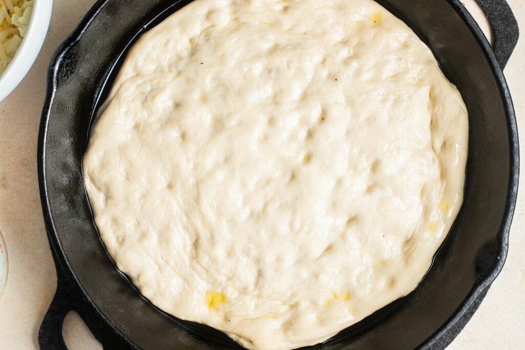 pizza dough in a skillet
